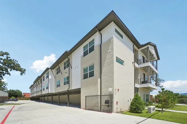 a front view of a house with large windows