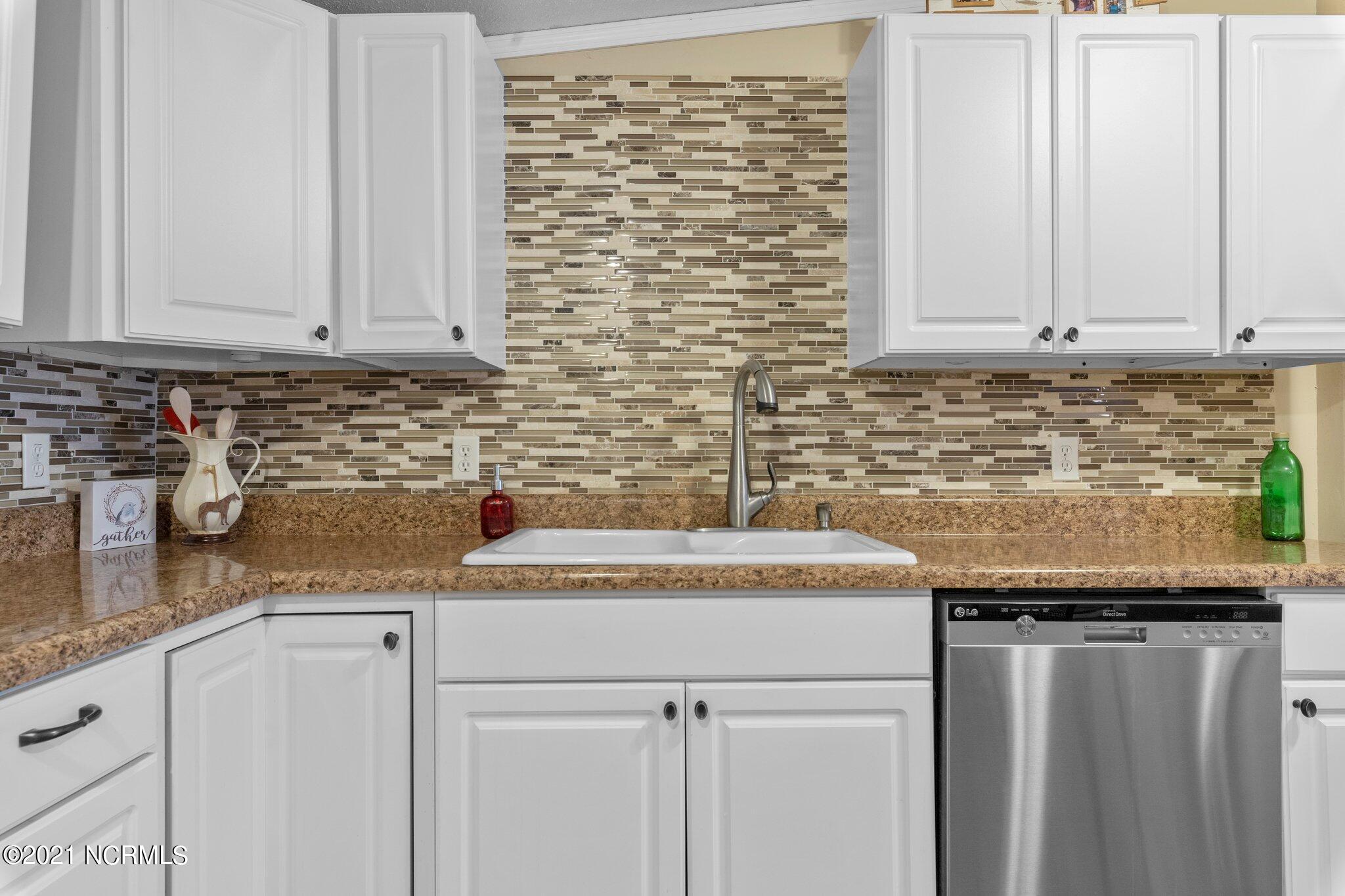1477 Farm Life School Road Carthage, NC 28327 - Photo 15 of 32 Kitchen sink and dishwasher within easy reach.