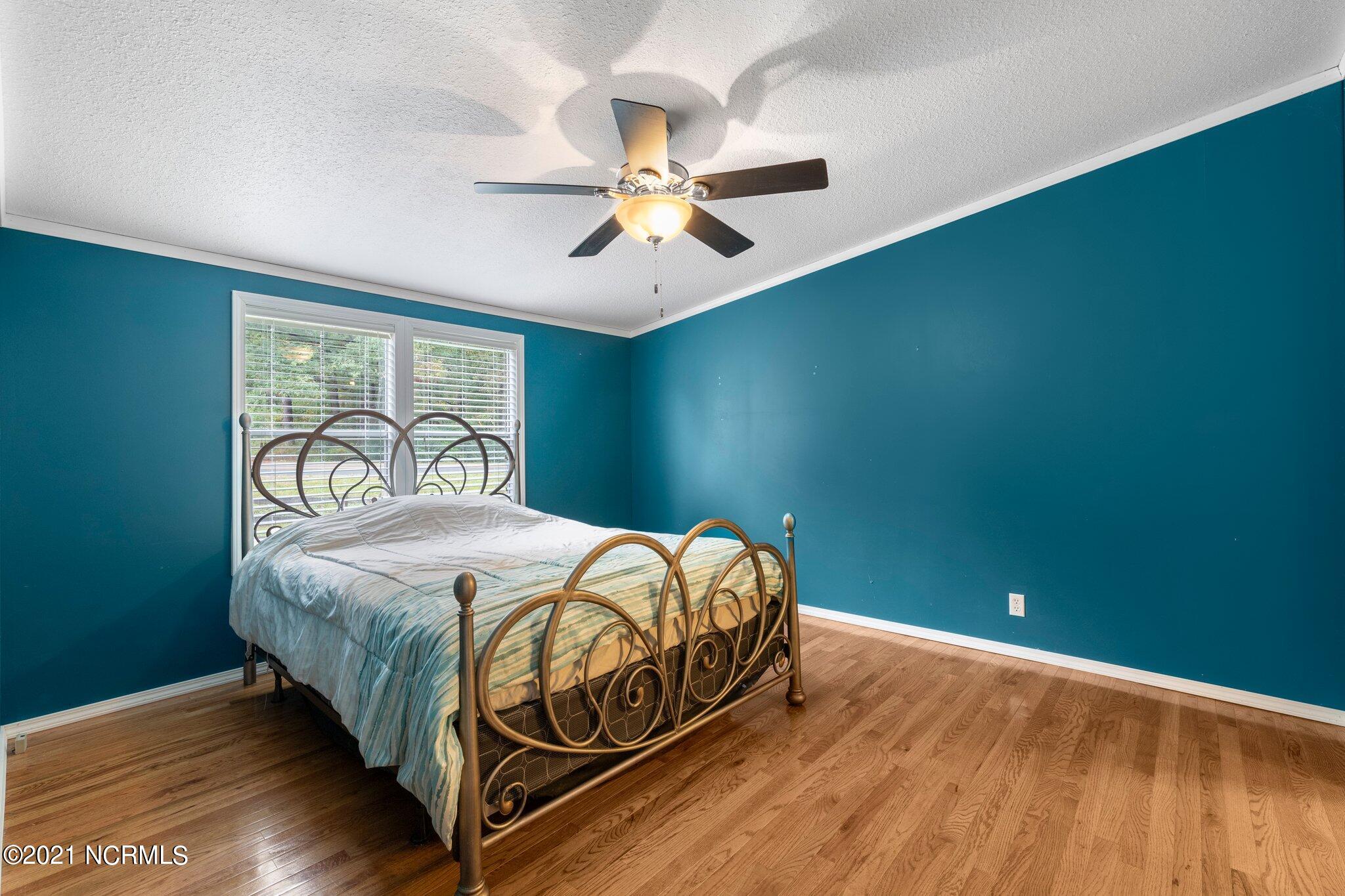 1477 Farm Life School Road Carthage, NC 28327 - Photo 18 of 32 Master bedroom is bright yet cosy.