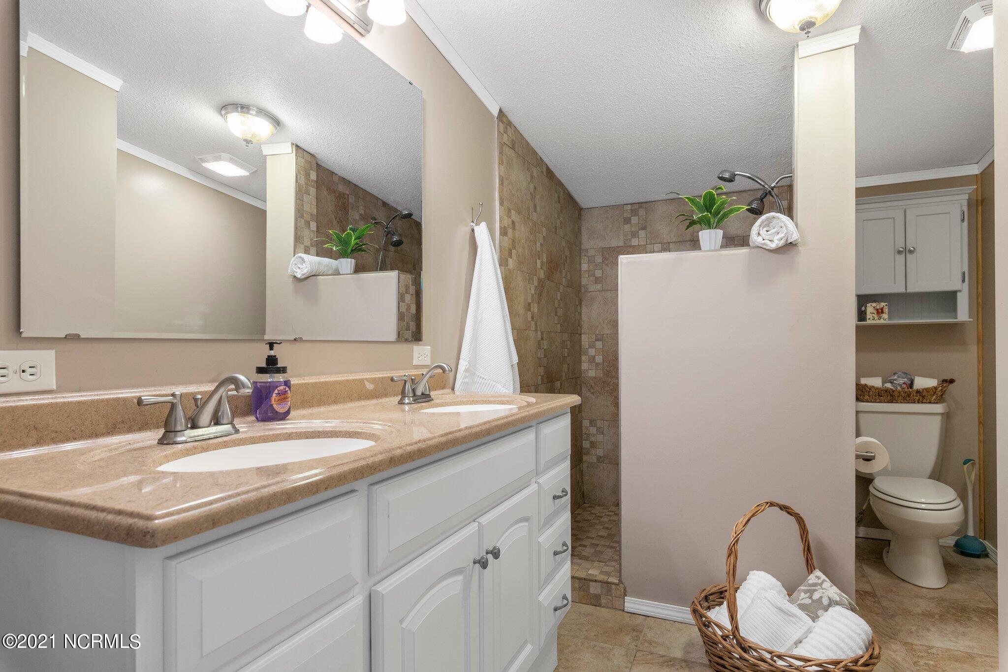 1477 Farm Life School Road Carthage, NC 28327 - Photo 19 of 32 Master en-suite bathroom with walk-in shower.