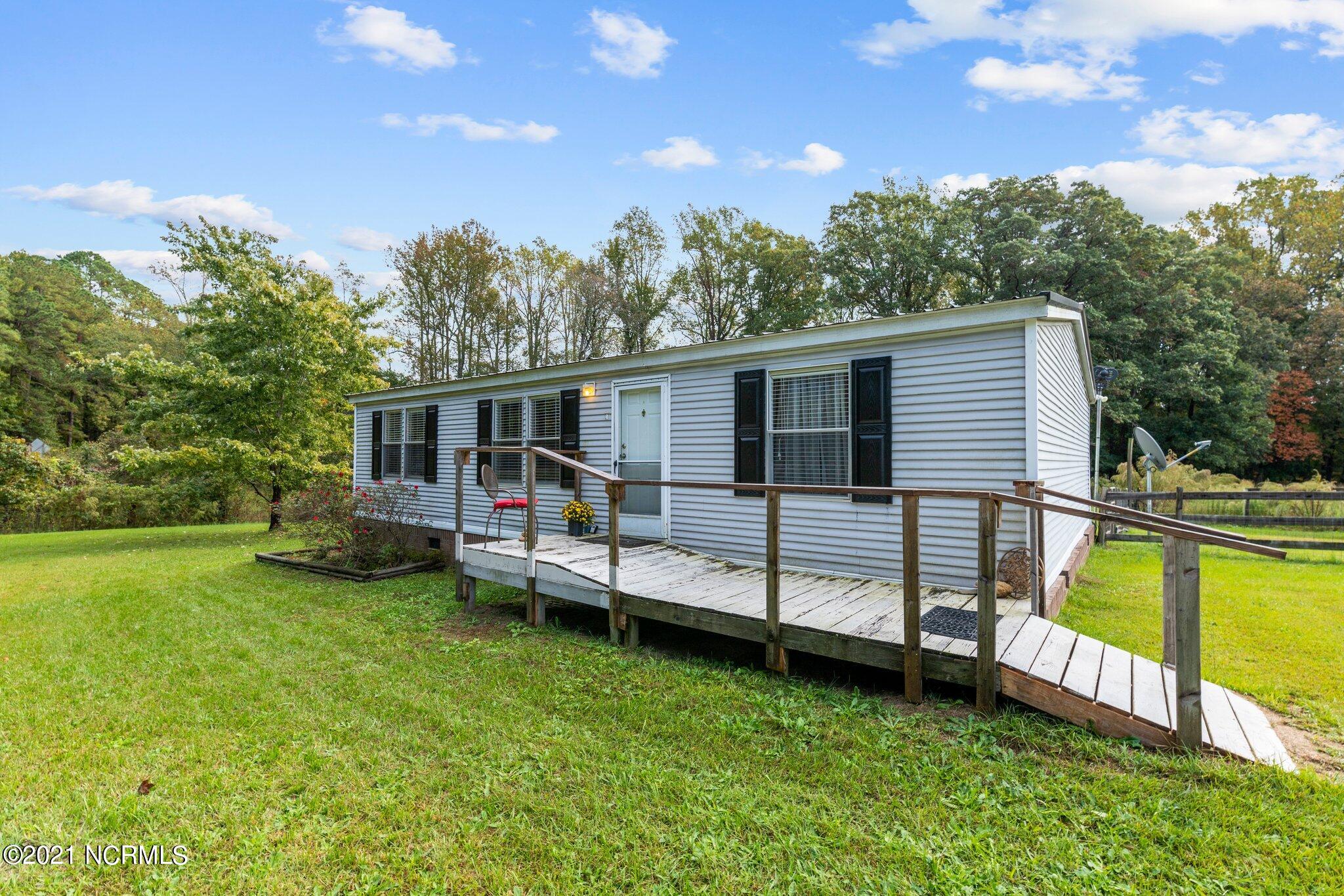 1477 Farm Life School Road Carthage, NC 28327 - Photo 2 of 32 Front porch and ramp make easy access when carrying groceries in!