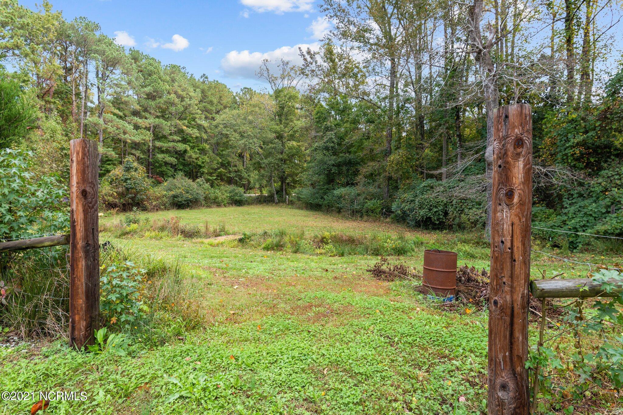 1477 Farm Life School Road Carthage, NC 28327 - Photo 23 of 32 Entrance from main back yard to additional acreage with small stream.