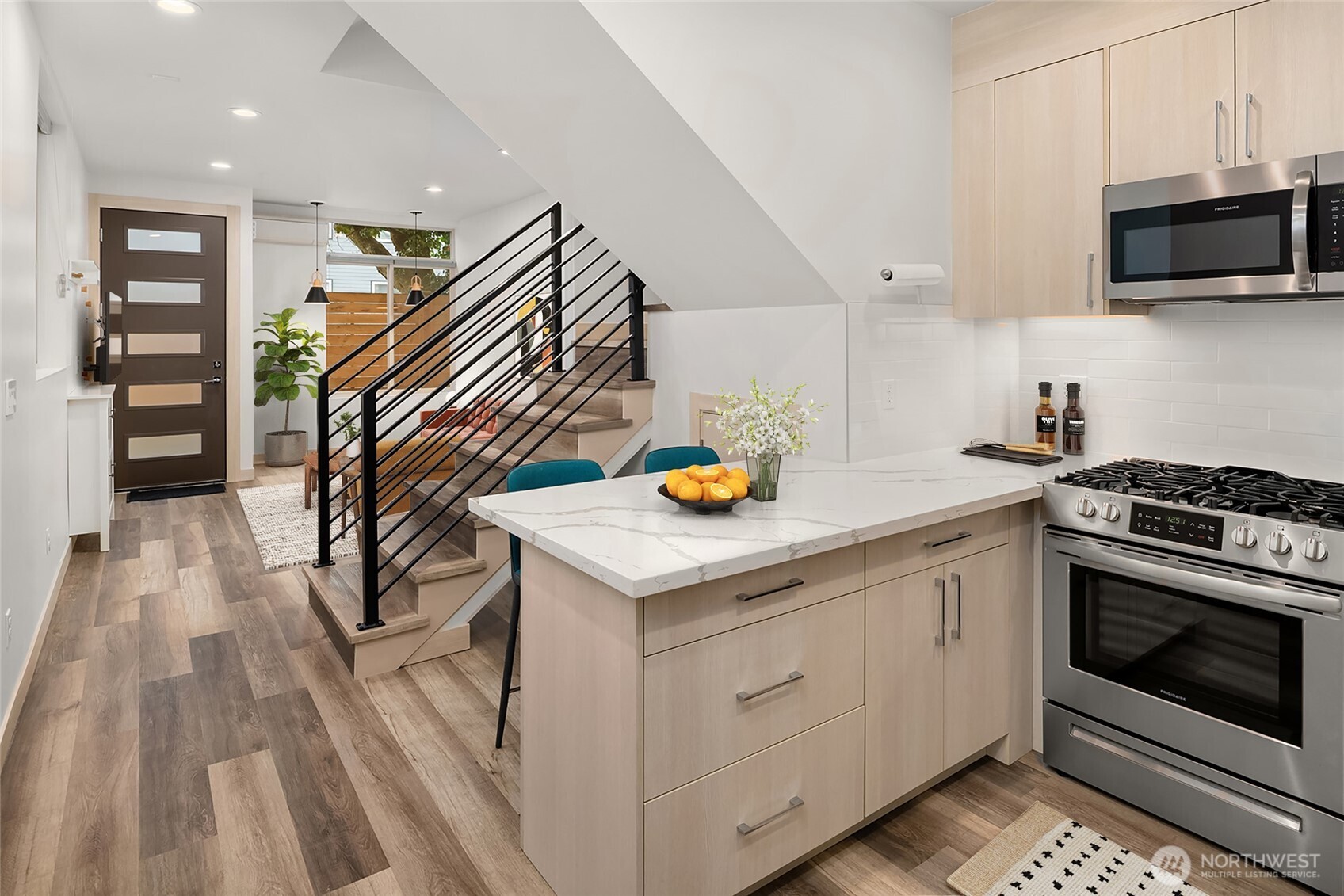 5616 California Avenue Southwest, Unit C Seattle, WA 98136 - Photo 12 of 36 a kitchen with stainless steel appliances granite countertop a stove and a sink