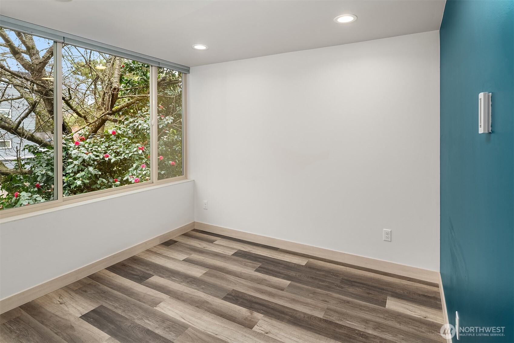 5616 California Avenue Southwest, Unit C Seattle, WA 98136 - Photo 18 of 36 a view of room with window and hardwood