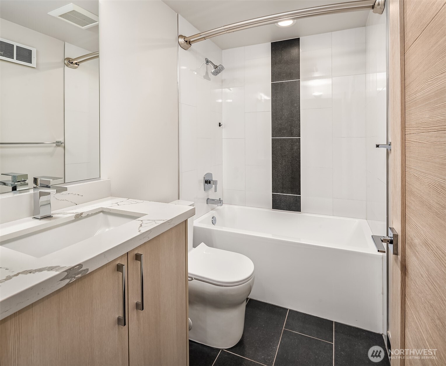 5616 California Avenue Southwest, Unit C Seattle, WA 98136 - Photo 20 of 36 a bathroom with a granite countertop sink toilet and shower