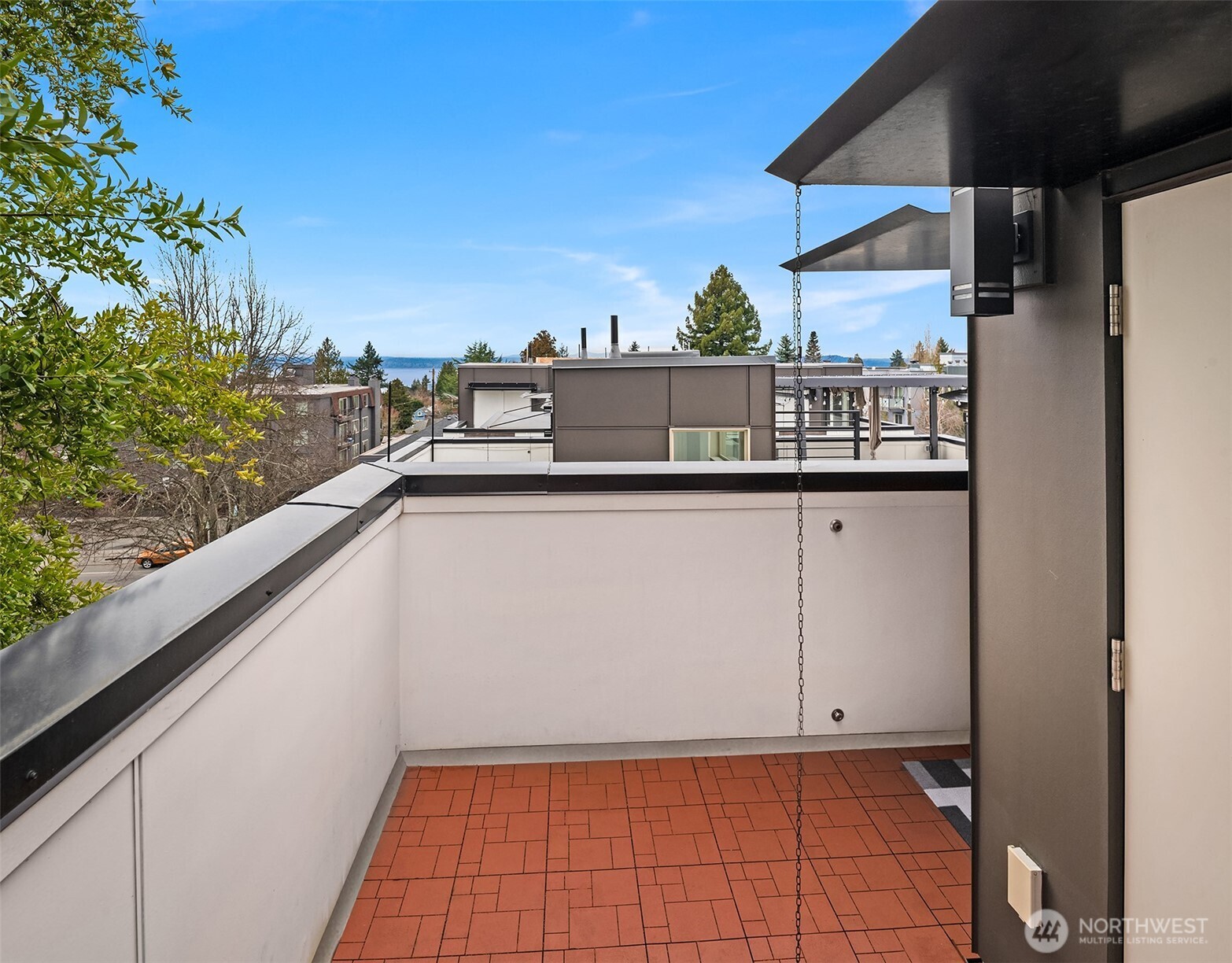 5616 California Avenue Southwest, Unit C Seattle, WA 98136 - Photo 29 of 36 a view of a terrace from a balcony