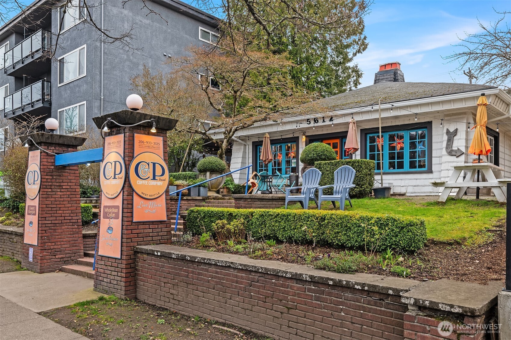 5616 California Avenue Southwest, Unit C Seattle, WA 98136 - Photo 34 of 36 a front view of a building with a garden