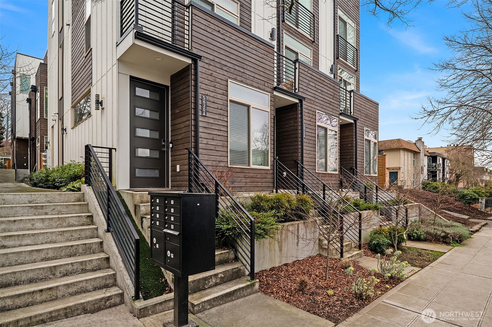 5616 California Avenue Southwest, Unit C Seattle, WA 98136 - Photo 36 of 36 a view of a house with chairs and table