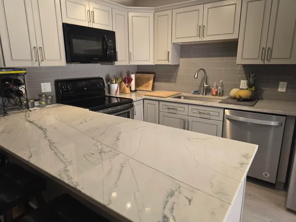 a kitchen with a sink and cabinets