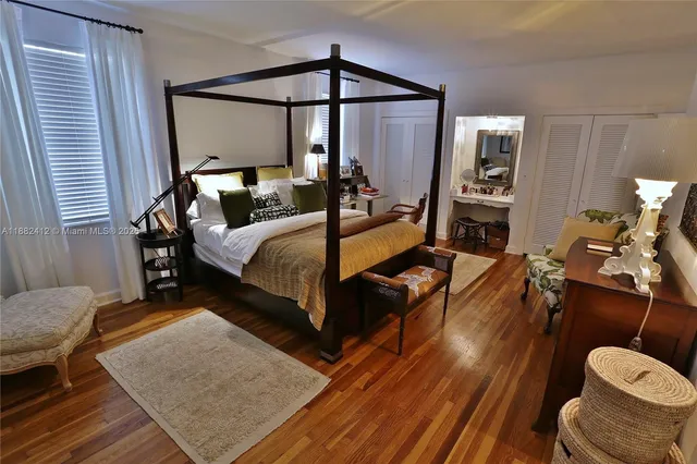 a living room with furniture and a mirror