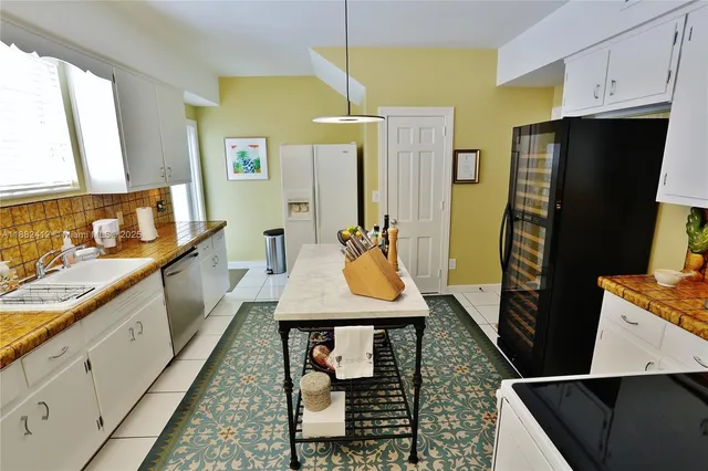 a bathroom with a sink a mirror and a shower