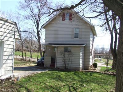 323 Perdue Avenue Akron, OH 44310 - Photo 10 of 11 View of the back with small porch. Subject to short sale.