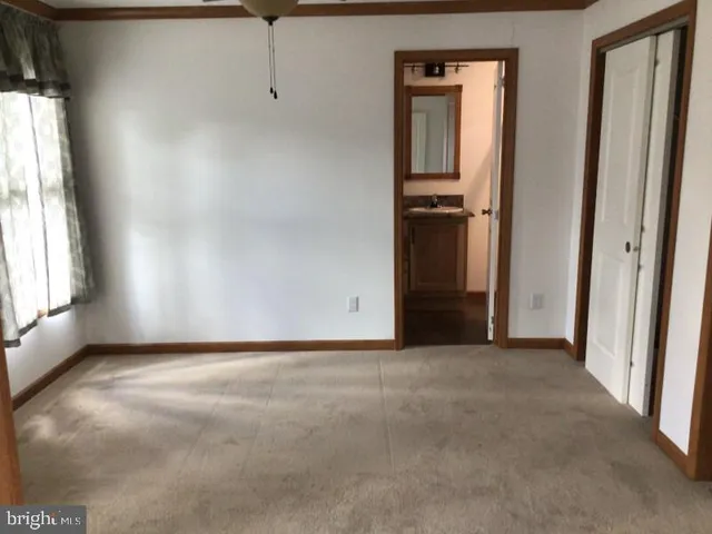 a view of empty room with windows