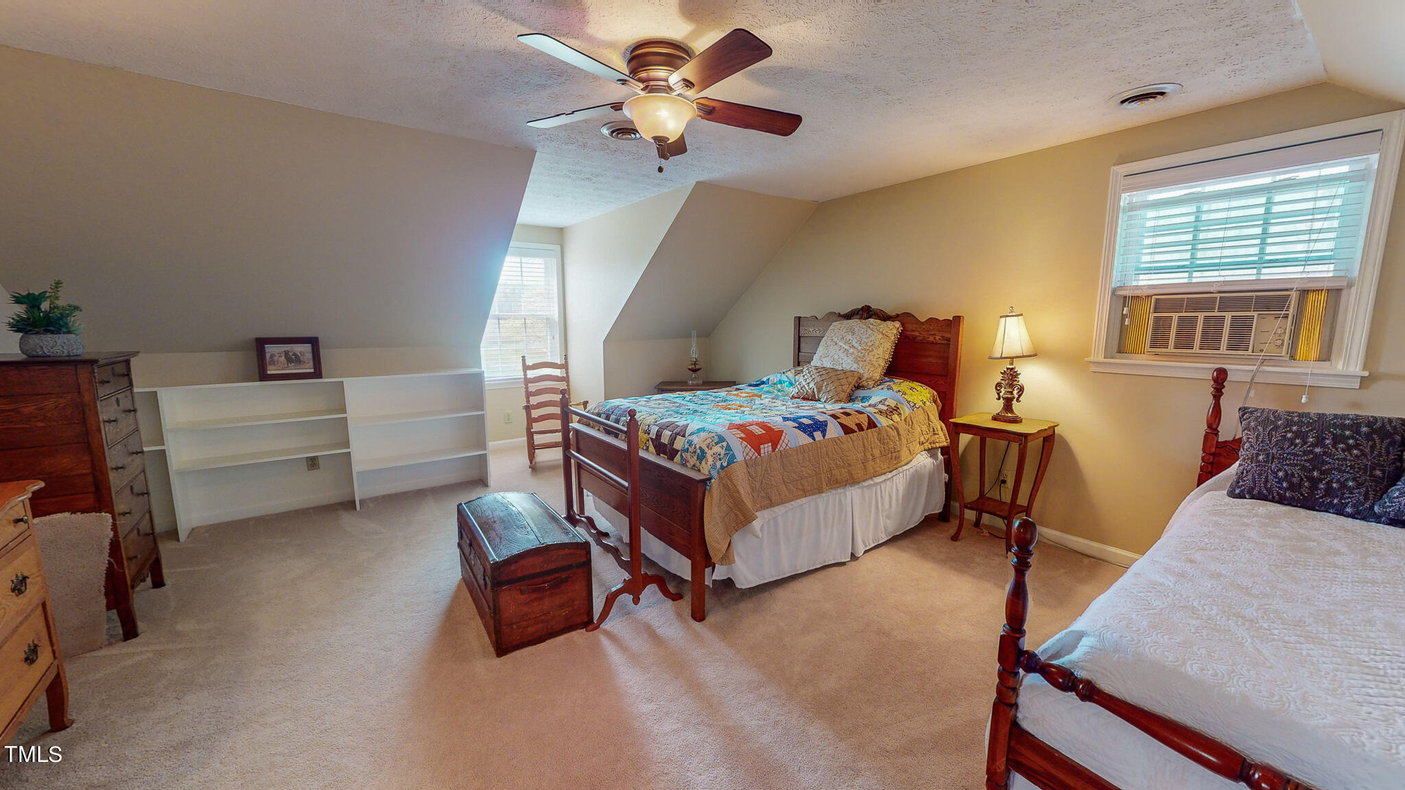 1342 Paynes Tavern Road Roxboro, NC 27574 - Photo 34 of 71 a bedroom with a bed and a chandelier