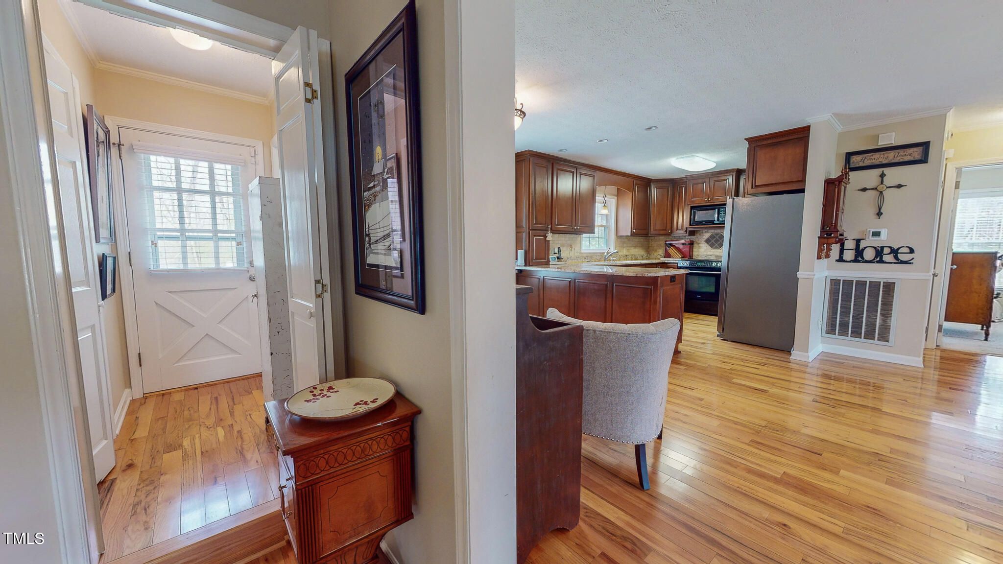 1342 Paynes Tavern Road Roxboro, NC 27574 - Photo 54 of 71 a kitchen with stainless steel appliances granite countertop a refrigerator and a stove top oven