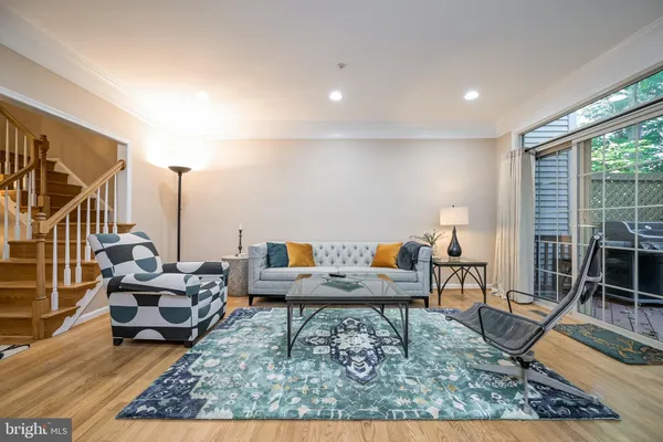 a living room with furniture and a rug