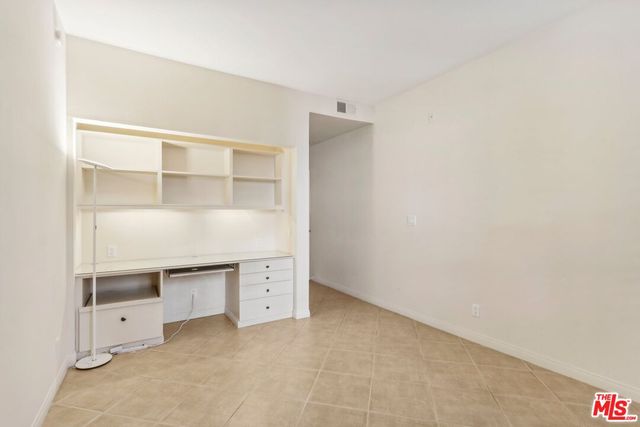 a close up view of a utility room with dryer and washer