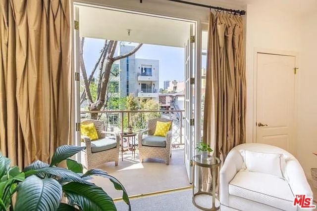 an empty room with a ceiling fan and a window