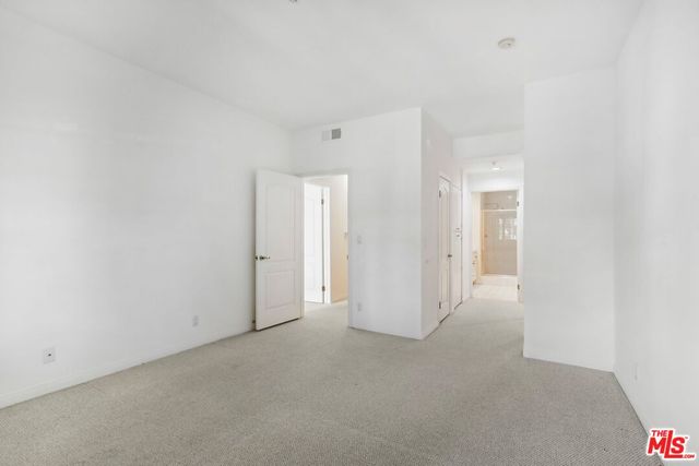 a bathroom with a shower a sink a toilet and a mirror