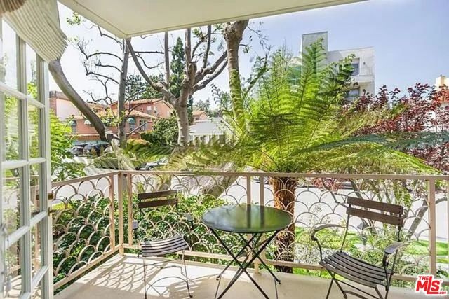 a view of a chairs and table in a patio