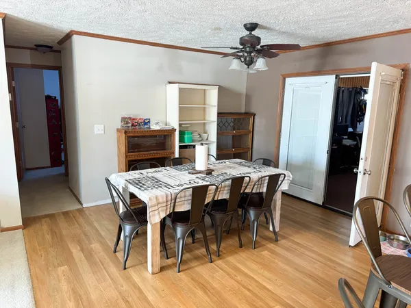 a living room with furniture a large window and a flat screen tv