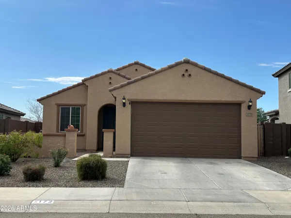 a front view of a house with garage