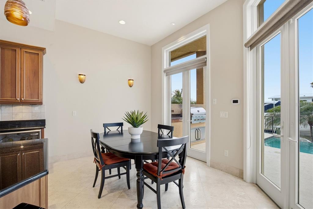 761 Norton Street Longboat Key, FL 34228 - Photo 18 of 66 a view of a dining room with furniture and window