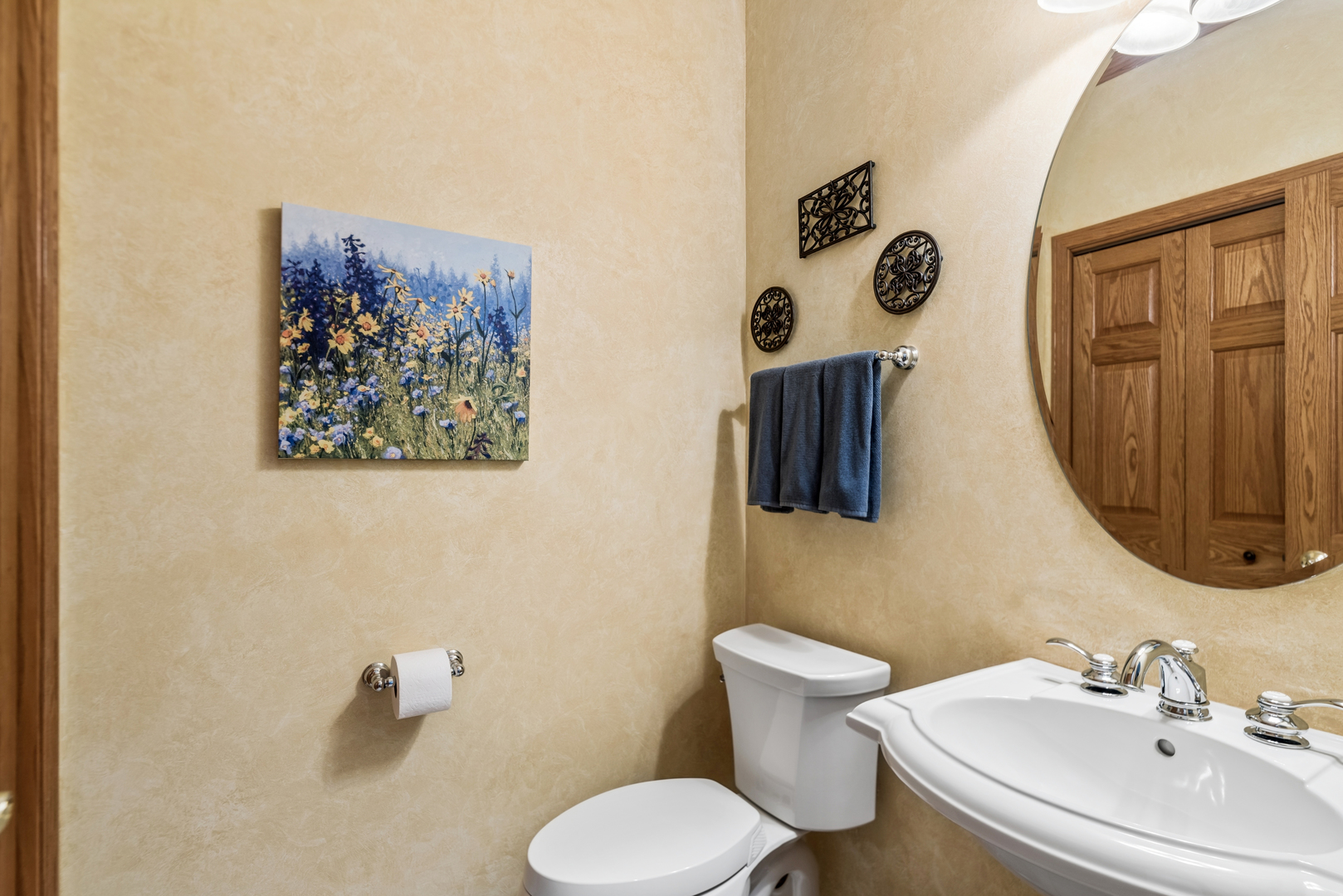 10907 Red Hawk Lane Spring Grove, IL 60071 - Photo 24 of 44 a bathroom with a toilet sink and mirror
