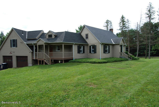 48 Interlaken Road Stockbridge, MA 01262 - Photo 1 of 37 a view of a house with a backyard