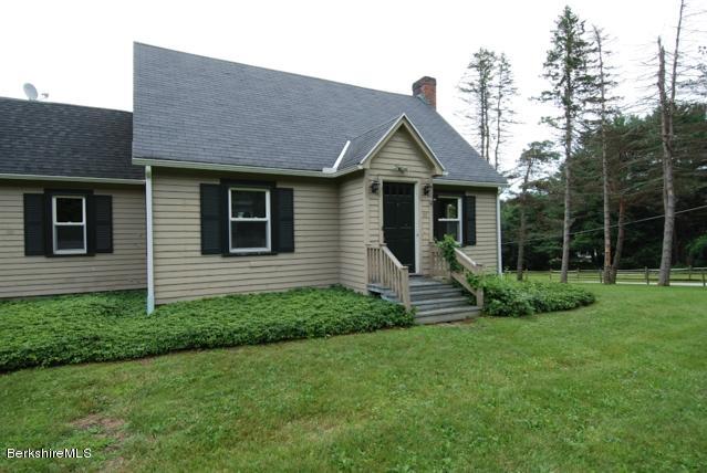 48 Interlaken Road Stockbridge, MA 01262 - Photo 2 of 37 a front view of a house with a garden