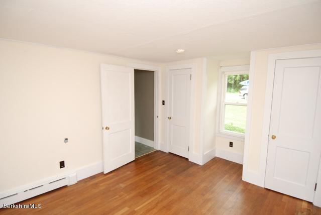 48 Interlaken Road Stockbridge, MA 01262 - Photo 12 of 37 wooden floor in an empty room