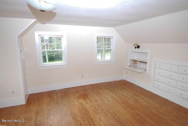 48 Interlaken Road Stockbridge, MA 01262 - Photo 13 of 37 a view of an empty room with a window and wooden floor