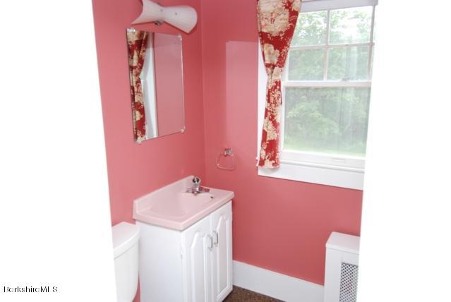 48 Interlaken Road Stockbridge, MA 01262 - Photo 26 of 37 a bathroom with a sink and a mirror