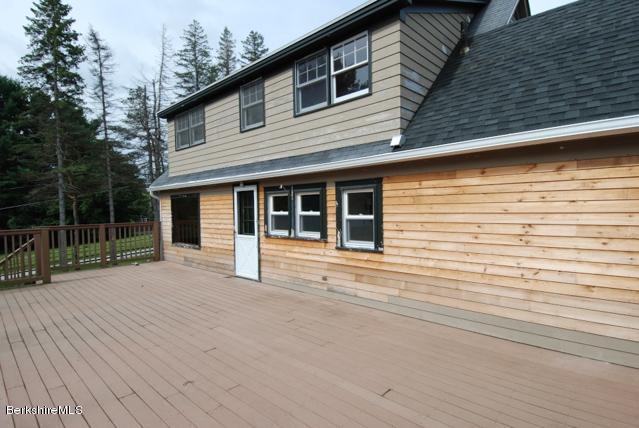 48 Interlaken Road Stockbridge, MA 01262 - Photo 30 of 37 a backyard of a house with seating space