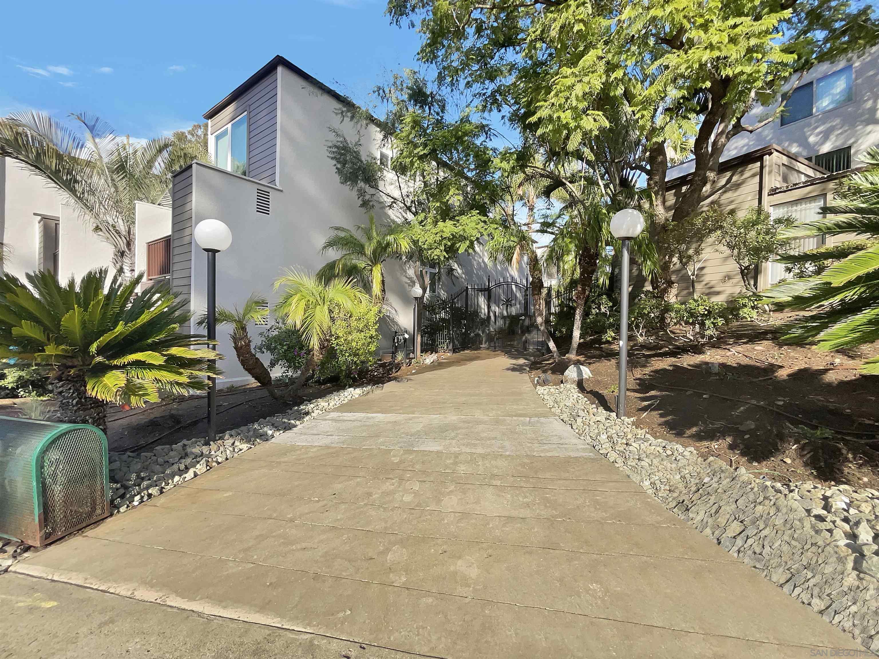 4545 Collwood Boulevard, Unit 40 San Diego, CA 92115 - Photo 1 of 29 a view of a pathway with a yard