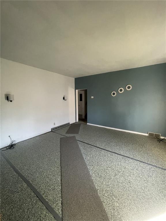 629 Forrest Street New Castle, PA 16101 - Photo 5 of 10 an empty room with windows