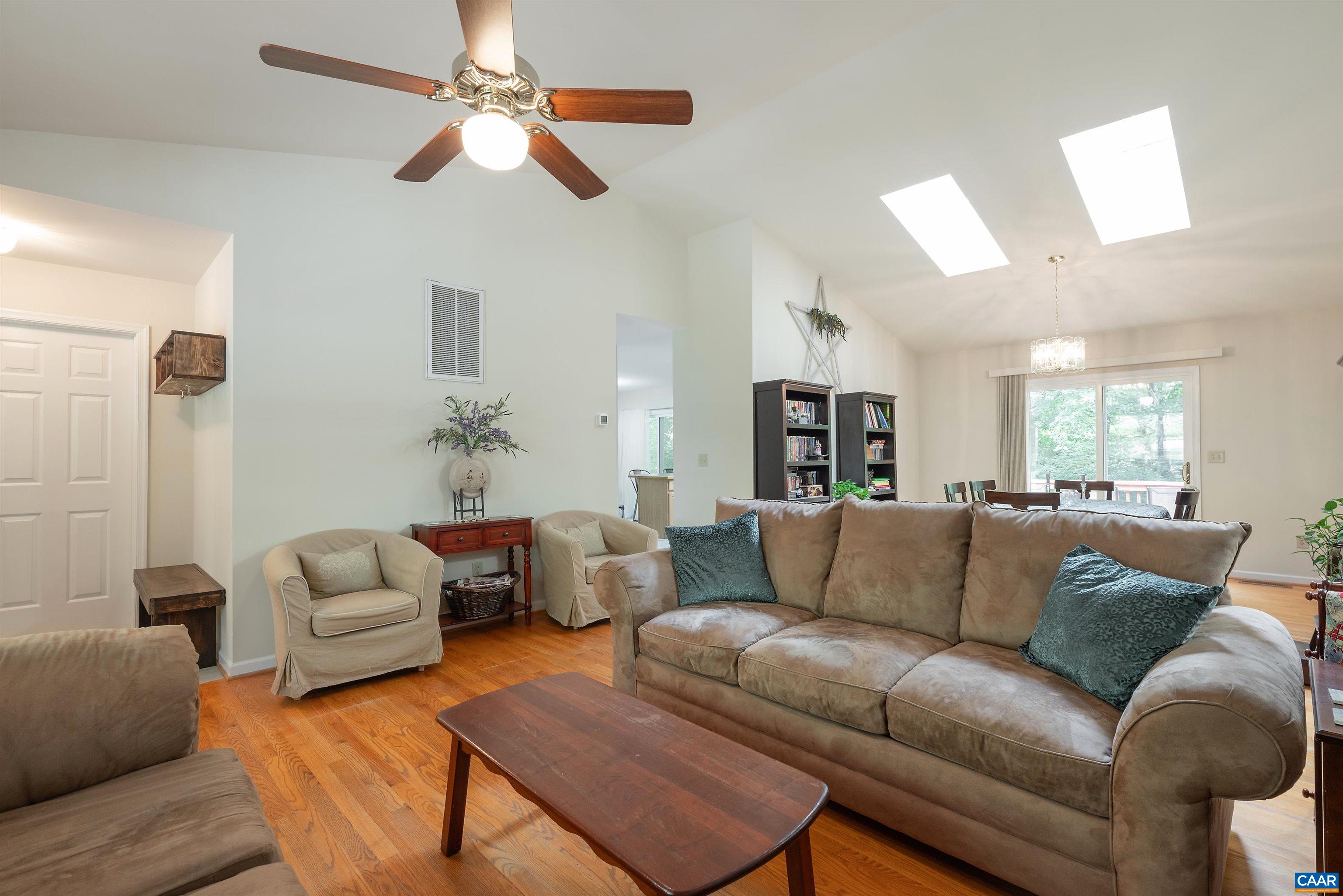 23 Zephyr Road Palmyra, VA 22963 - Photo 3 of 26 a living room with furniture a ceiling fan and a couch