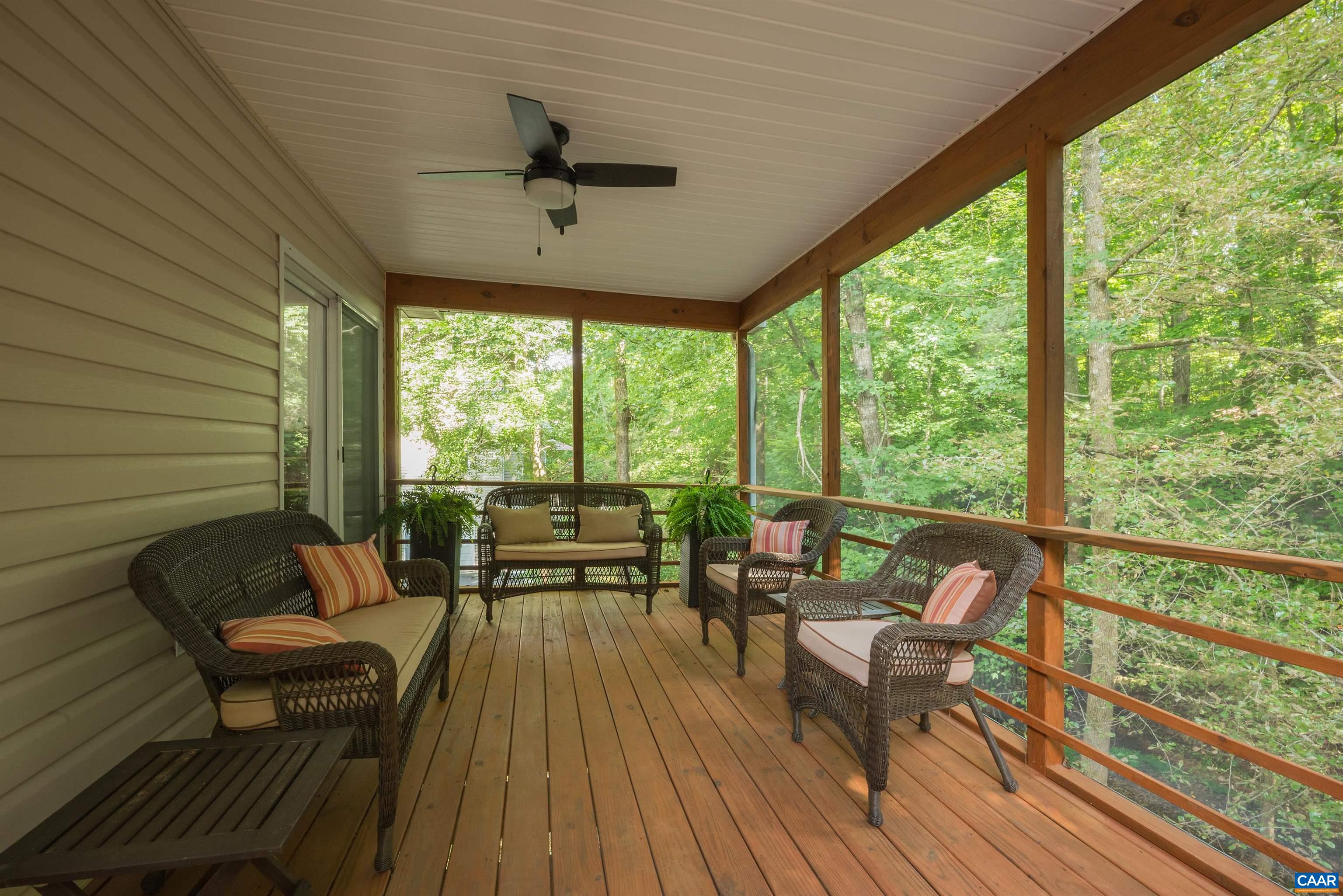 23 Zephyr Road Palmyra, VA 22963 - Photo 8 of 26 a balcony with wooden floor and outdoor seating