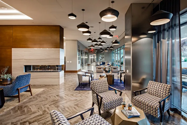 a outdoor space with lots of furniture and a view of fountain