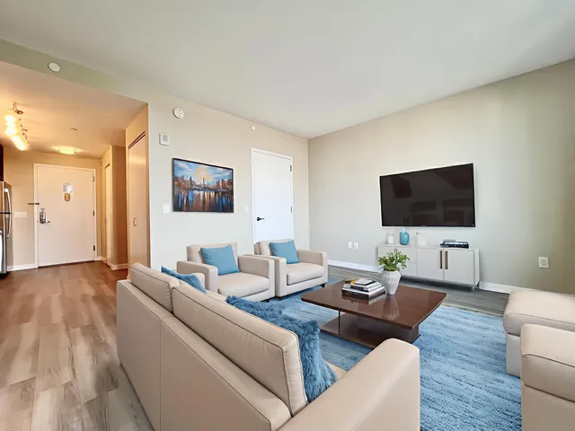 a bedroom with a bed and a couch