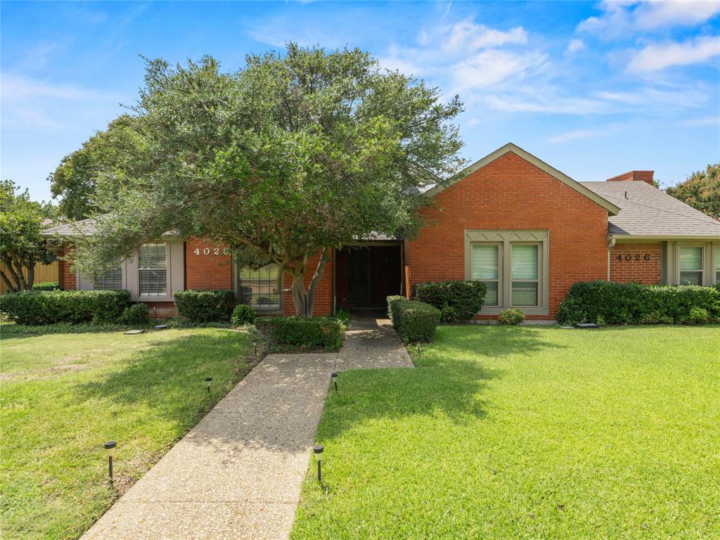 4028 St Christopher Lane Dallas, TX 75287 - Photo 1 of 29 a front view of a house with a yard