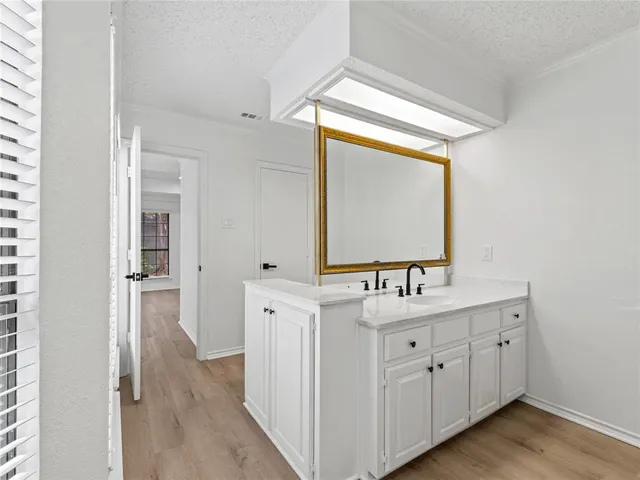 a bathroom with a double vanity sink and mirror
