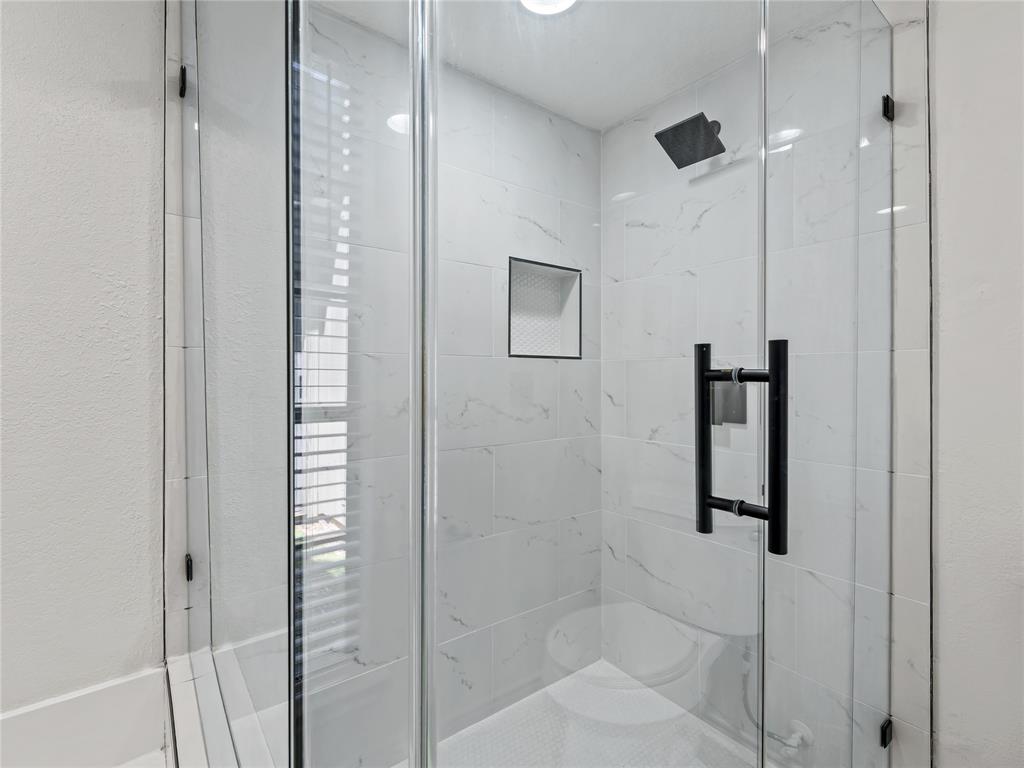 4028 St Christopher Lane Dallas, TX 75287 - Photo 26 of 29 a bathroom with a shower