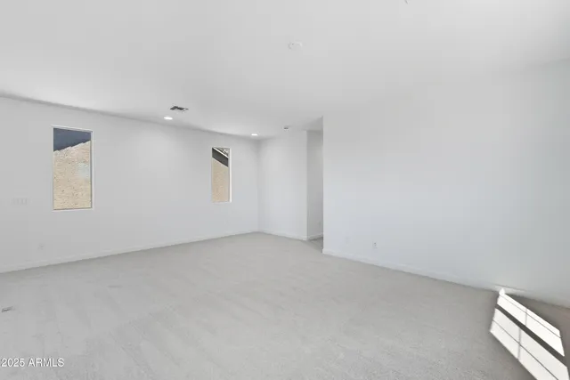 a view of empty room with windows