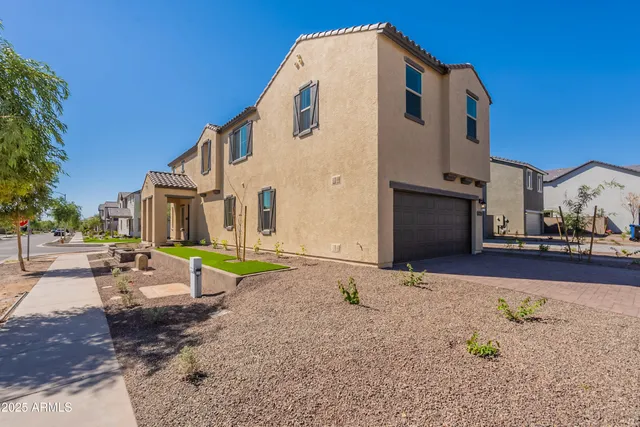 a view of a house with wooden fence