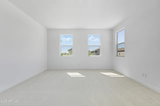 a view of a lake with a bench and trees