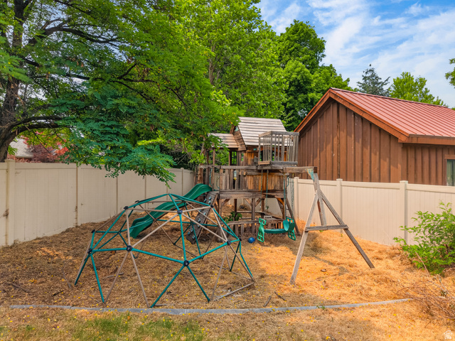 1279 West 1500th Street North Mapleton, UT 84664 - Photo 70 of 83 Spacious backyard area featuring a wooden playset with slide, dome climber, and swing set