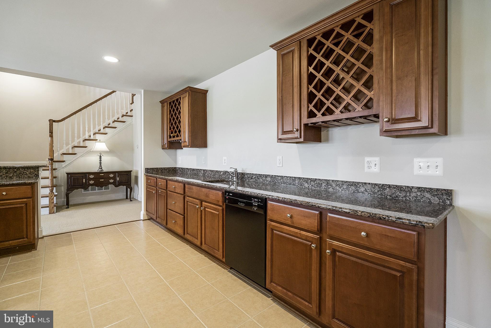 41382 Raspberry Drive Leesburg, VA 20176 - Photo 31 of 43 Enjoy the custom bar in the finished lower level!