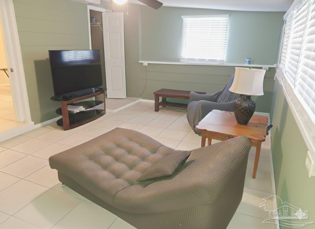 6274 Munson Highway Milton, FL 32570 - Photo 6 of 26 a living room with furniture and a flat screen tv