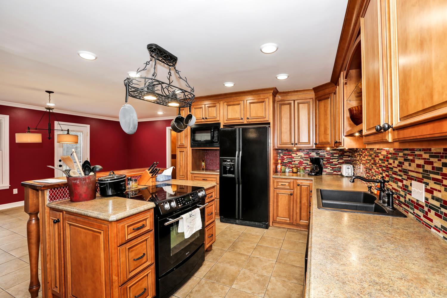 17 Lewter Road Taft, TN 38488 - Photo 19 of 30 a kitchen with stainless steel appliances granite countertop a stove refrigerator and cabinets